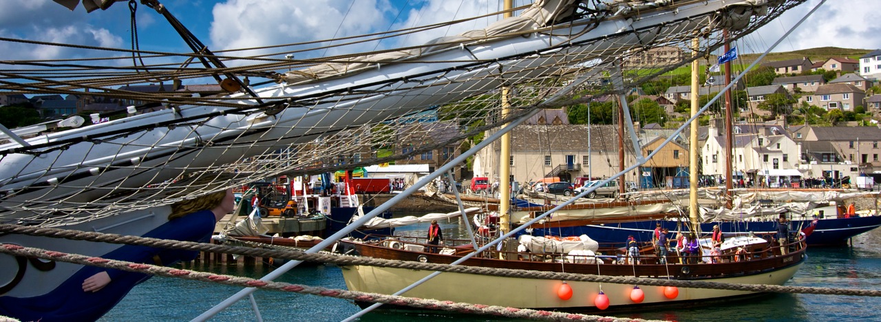 View across Stromness harbour to The Ferry Inn on the occasion of the visit of the Tall Ships in 2011